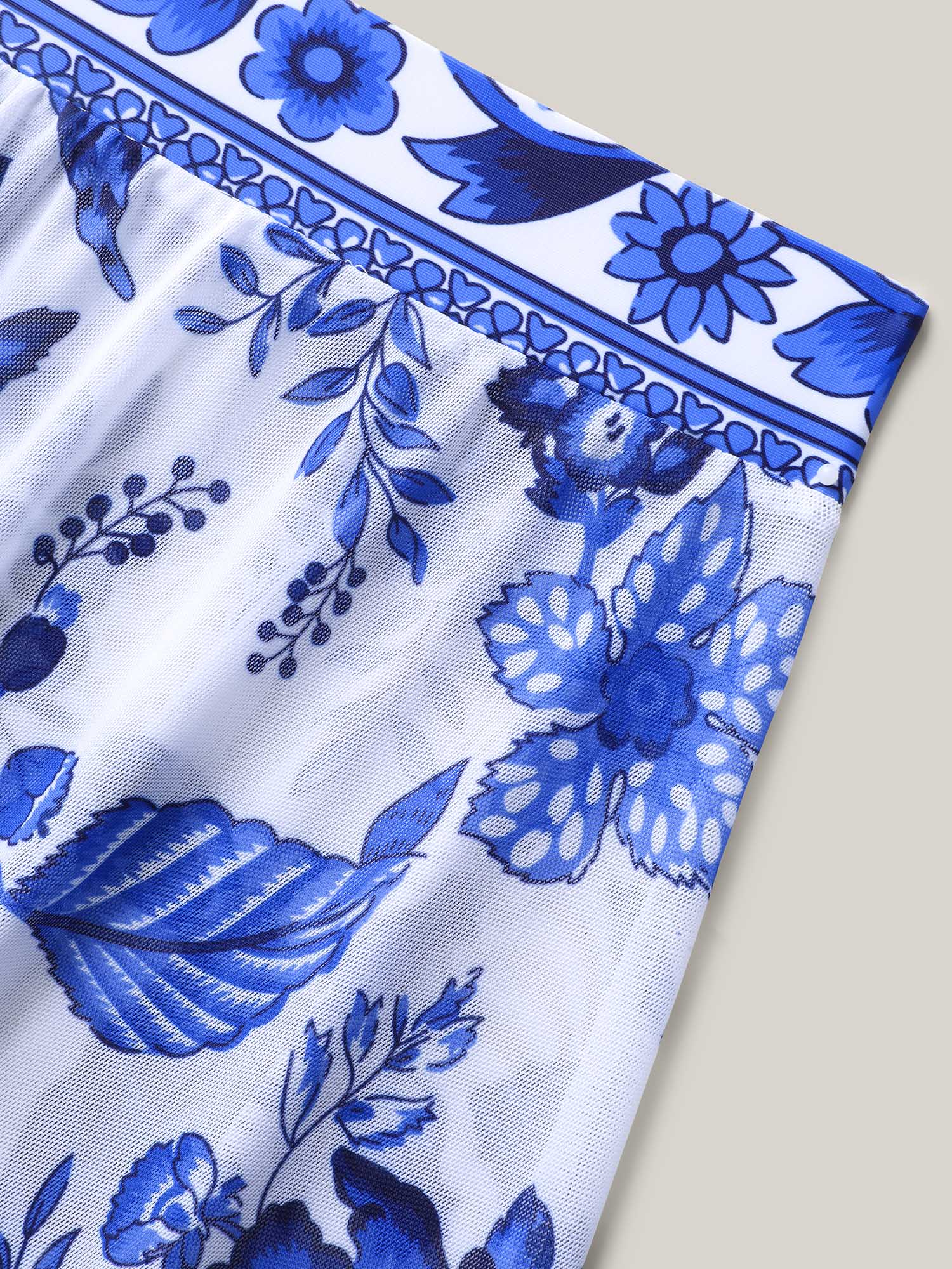 Flora™ | Two-Piece Swimsuit with Floral Pattern and Ruffled Mesh, Sarong